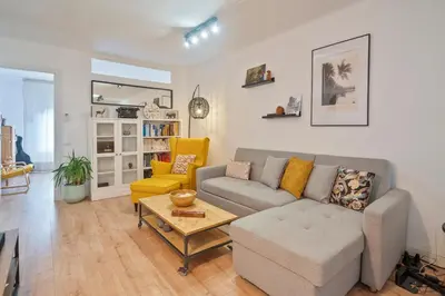 a living room with a couch and a table at BCN: ¡Exclusivos y cerca del Camp Nou! in El Arrabal