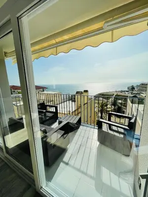 a balcony with a view of the ocean at La Marina2 SeaView with amazing terrace in Sitges