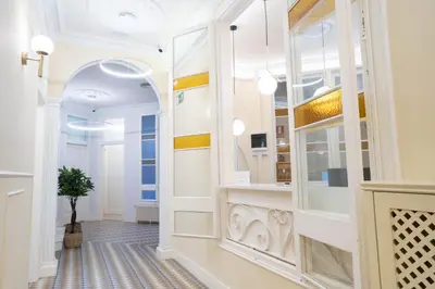 a hallway with a mirror and a potted plant at Feelathome Casa Bertrand in Barcelona