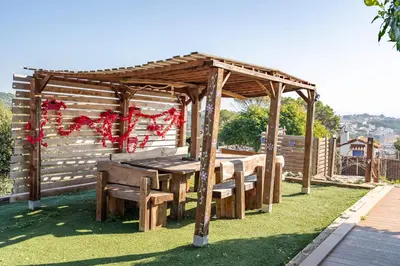 a bedroom with a bed and a table in a room at \u30c4 Villa Carrasca l Luxe l Vista al Mar l Piscina Climatizada l Nature in Arenys de Munt