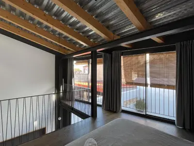 a room with a balcony with sliding glass doors at villa en el penedès in Gornal