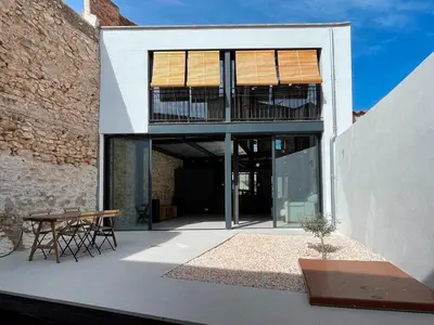 an external view of a house with a patio at villa en el penedès in Gornal