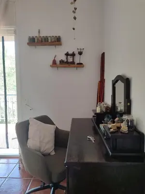a desk with a chair and a mirror in a room at Habitación privada en casa particular, montaña in Olesa de Bonesvalls