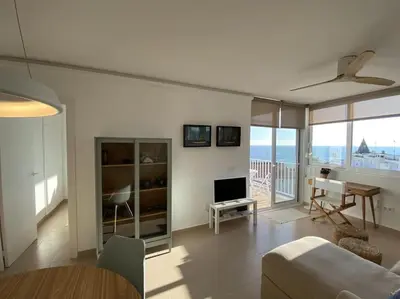 a living room with a view of the ocean at Montaber Apartments - Sant Pol de Mar in San Pol de Mar