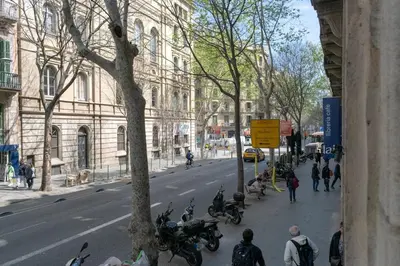 a group of motorcycles parked on a city street at 