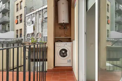 a washing machine in the side of a building at Stay U-nique Apartments Torre Damians in Barcelona