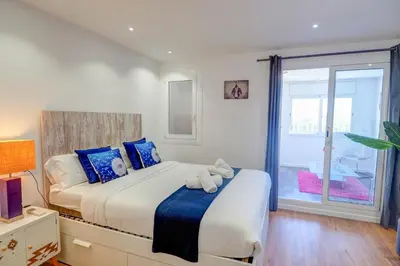 a bedroom with a bed with two stuffed animals on it at The Moonlight Sea View by Hello Homes Sitges in Sitges