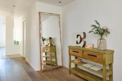 a mirror and a dresser in a room at Factory Apartments Barcelona in Barcelona