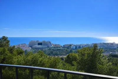 a view of the ocean from a balcony at Villa Sitges Julia Vista Espectacular 2 k m s de la Playa Comoda & Area Tranquila Amplitud interior y plana in Sitges
