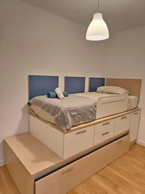 a bedroom with a large bed in a room at Cute apartment Sant Adria beach in Sant Adria de Besos