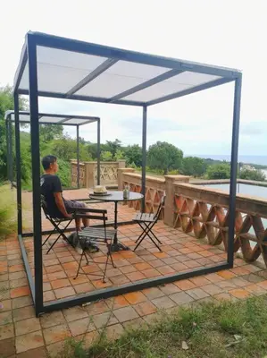 a man sitting at a table on a patio at Romantic Stay in Grand Setting in Alella