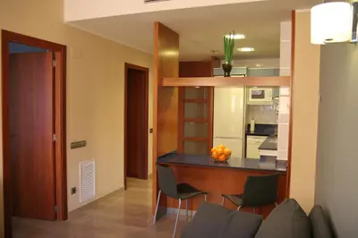 a kitchen and dining room with a table and chairs at Apartaments Independencia in Barcelona