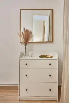 a dresser with a mirror on top of it at BBarcelona Calabria Flat in Barcelona