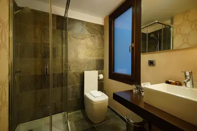 a bathroom with a toilet and a sink and a shower at Casa Boutique Barcelona in Barcelona