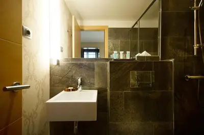 a bathroom with a sink and a mirror at Casa Boutique Barcelona in Barcelona