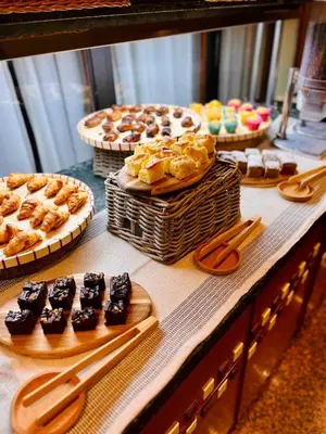 a display case with different types of pastries and desserts at Ciudad de Castelldefels in Castelldefels