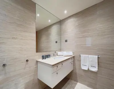 a bathroom with a sink and a mirror at Stay Unique Apartments Diagonal III in Barcelona