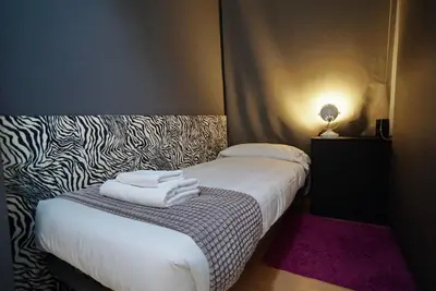 a bedroom with a bed with two towels on it at Barcelona4Seasons II in Barcelona
