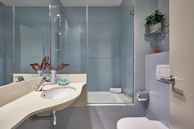 a bathroom with a sink and a tub and a toilet at BBarcelona Diputació Flat in Barcelona