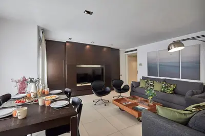 a living room with a couch and a table at BBarcelona Diputació Flat in Barcelona