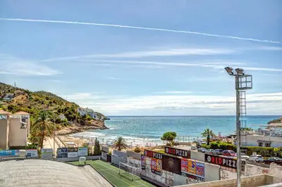 a view of the beach from a building at The Beach Studio by Hello Homes Sitges in Sitges