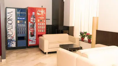 a living room with a cocacola soda machine at Hotel Coronado in Barcelona