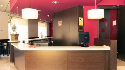 an office with a desk with a computer on it at Hotel Coronado in Barcelona