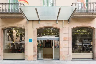 a store front of a hotel with the doors open at Hotel Sant Agustí in Barcelona