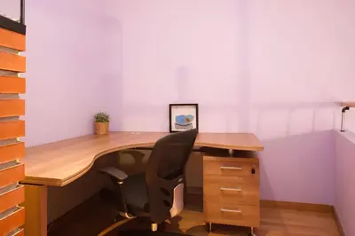 an office with a wooden desk and a chair at Vale Beach in Barcelona