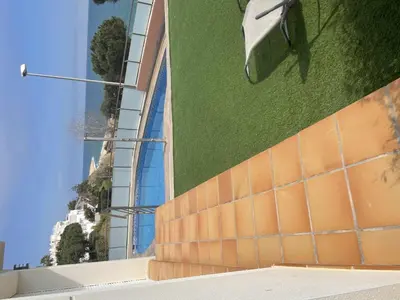 a view of a building from the side of a building at Villa Farell just in front of the sea in San Pol de Mar
