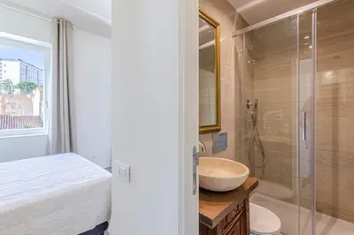 a bathroom with a sink and a shower at El Petit Palauet in Canet de Mar