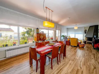 a kitchen and dining room with a table and chairs at Apartment Millenium by Interhome in Premia de Dalt