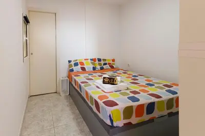 a bedroom with a bed with a box on it at Barcelona Sunny Terrace in Hospitalet de Llobregat