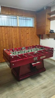 a large red foosball table in a room at Casa L'Avi in Palau-Solità i Plegamans