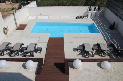 an overhead view of a swimming pool with chairs and a swimming pool at Exclusiva Villa de Lujo con piscina in Canyelles
