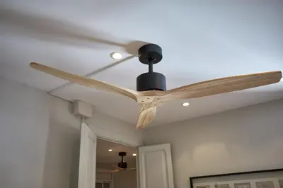 a ceiling fan hanging from a ceiling at BBarcelona Montjuic Apartment in Barcelona