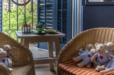 a group of teddy bears sitting on a chair at Bed&BCN Diagonal 5 in Barcelona