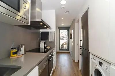 a kitchen with a sink and a counter top at Sitges Spaces Sea View Oasis in Sitges