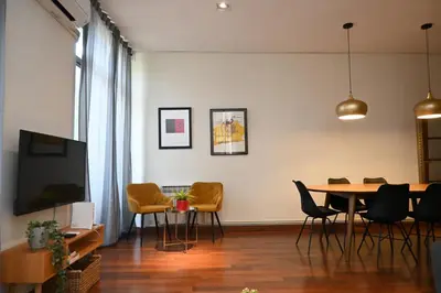 a dining room with a table and chairs at Homenfun Barcelona Las Ramblas in Barcelona