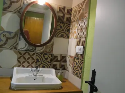 a bathroom with a sink and a mirror at Mas Can Puig de Fuirosos ONLY ADULTS in La Batlloria