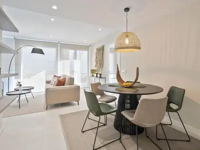a living room with a dining room table and chairs at Sitges Spaces Deluxe Comfort Flat-Monthly Rentals in Sitges