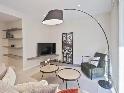 a living room with a couch and a table at Sitges Spaces Deluxe Comfort Flat-Monthly Rentals in Sitges