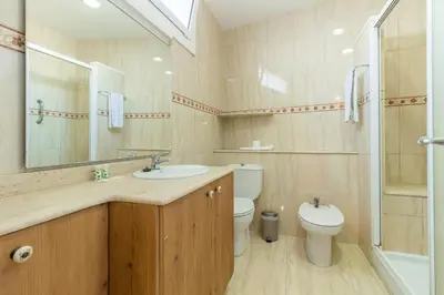 a bathroom with a sink and a toilet and a shower at BeBarceloner Sant Andreu Apartments - Studio in Barcelona