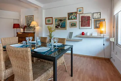 a dining room with a glass table and chairs at Habitat Apartments Ribes in Barcelona