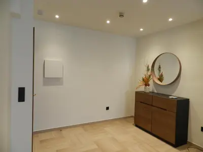 a white room with a mirror and a dresser at HOTEL MANEL in Martorell