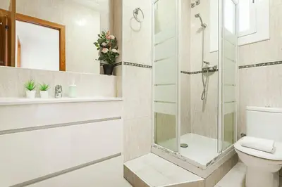 a bathroom with a shower and a toilet at The Collection Barcelona - Comfortable 3BD in Poblenou next to the beach only for Families! in Barcelona