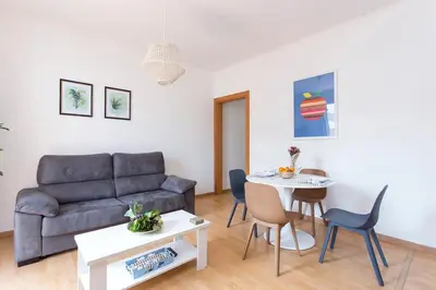 a living room with a couch and a table at The Collection Barcelona - 3BD only for Families in Poblenou next to the beach! in Barcelona