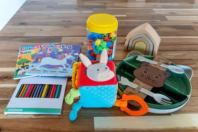 a table with toys and a toy car and a book at The Collection Barcelona - Sunny 3BD only for Families in Poblenou next to the sea! in Barcelona