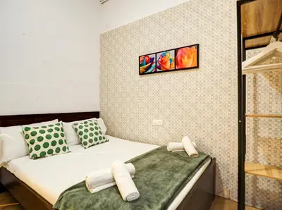 a small room with a bed and two pillows at Charming Patio by Hello Homes Sitges in Sitges