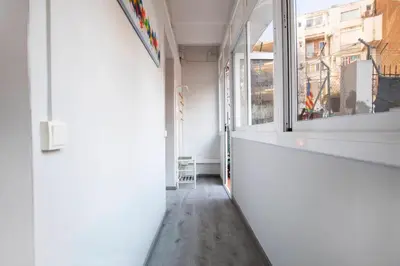 an empty hallway with a window in a building at P2PAR1002 - Super Bright & New Apartment in the city center in Barcelona
